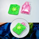 Small hot water bag with green sun cover, perfect for pain relief and warmth