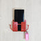 Set of 4 wall mounted storage boxes with hooks for organizing remotes.
