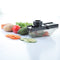 Ganesh plastic slicer cutter for vegetables, black, shown from different angles.