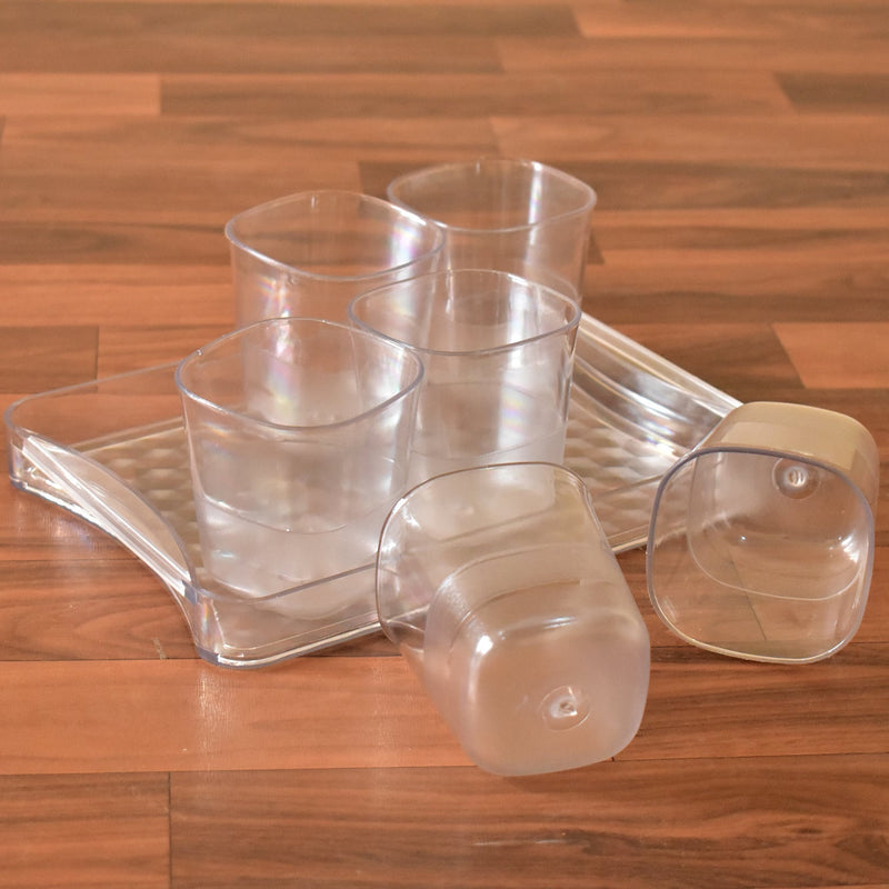 Transparent glasses set with tray for multiple drinks.