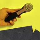 Manual rotary cutter for sewing projects.